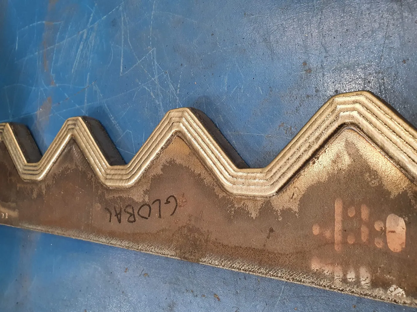 Cladding sample showing bead consistency and fill path
