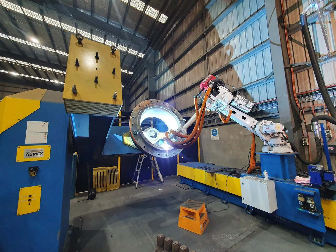 Robot welding a flanged vessel on a 10 tonne two axis positioner